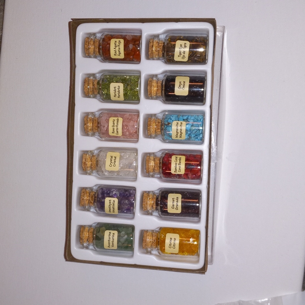 Selling a box of all new glass corked full of all different crystals